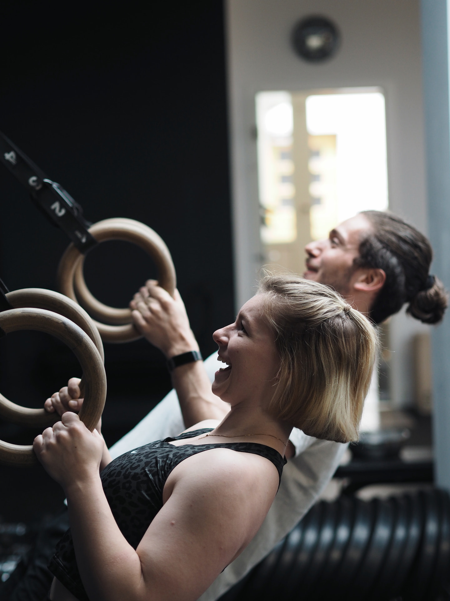Two athletes performing ring rows at Studio 58